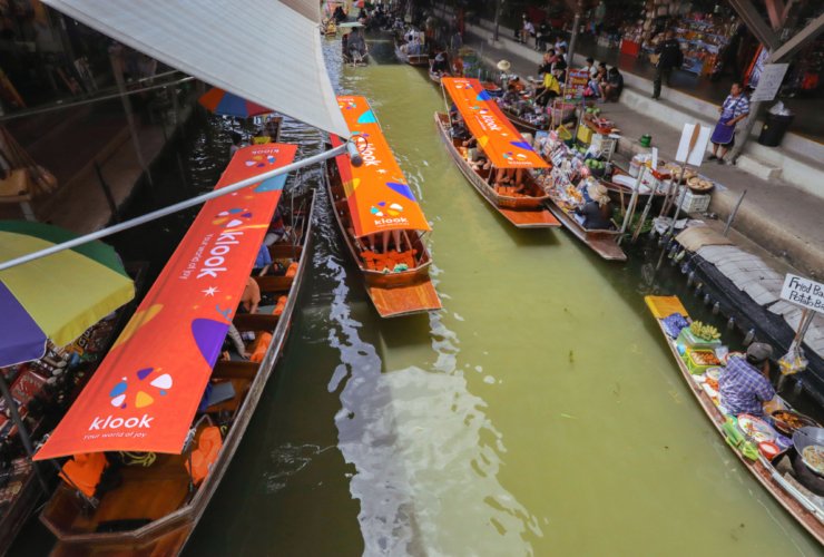 image of tourist boats in the floating market in Bangkok Thailand