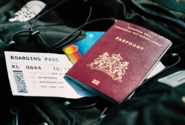 A file image of a passport and airline boarding pass.