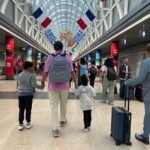 Johnny Jet and kids walking in ORD
