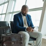 Man sitting at an airport gate