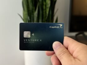 Nomadic Matt holding up his Capital One Venture X card