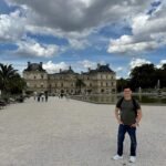 nomadic matt in front of the luxembourg gardens